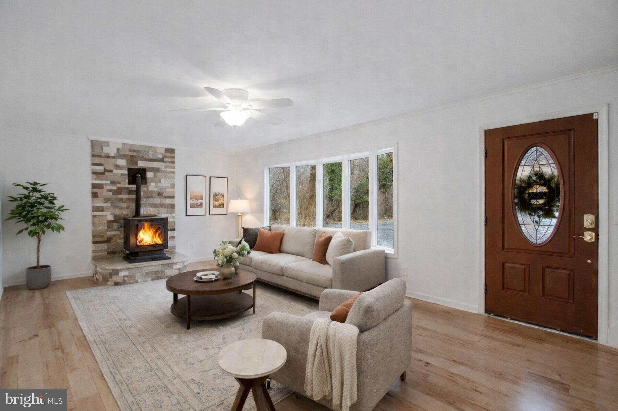 4350 Camp Kaufmann Road Huntingtown, MD 20639 - Photo 4 of 23 a living room with furniture and a fireplace