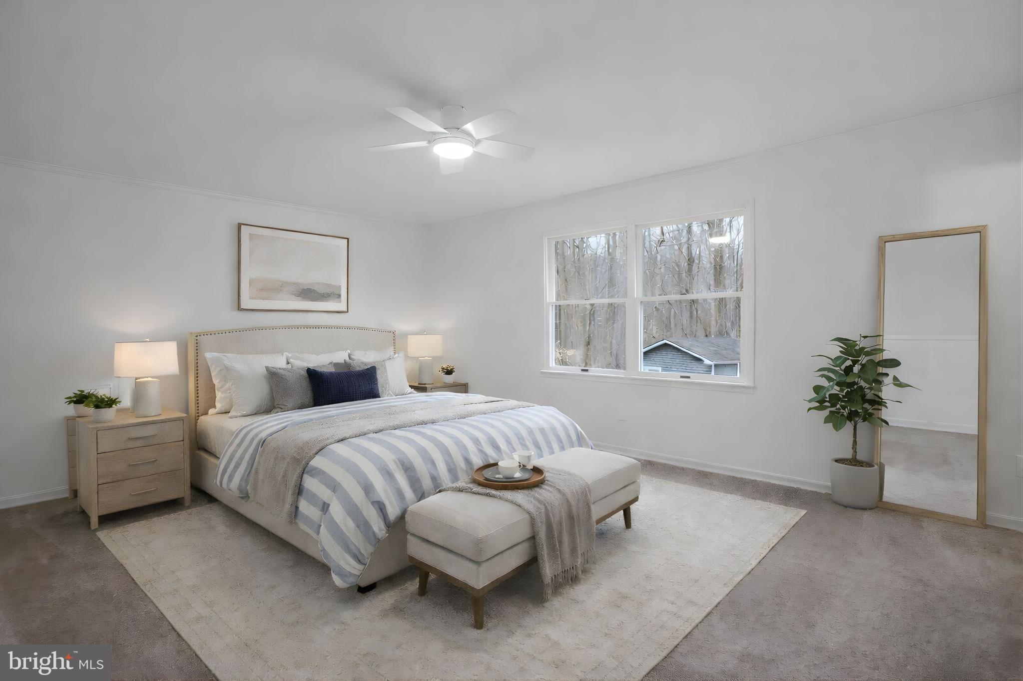 4350 Camp Kaufmann Road Huntingtown, MD 20639 - Photo 5 of 23 a spacious bedroom with a bed and window