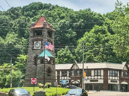 a front view of a residential apartment building with a yard