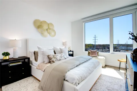 a bedroom with bed and window