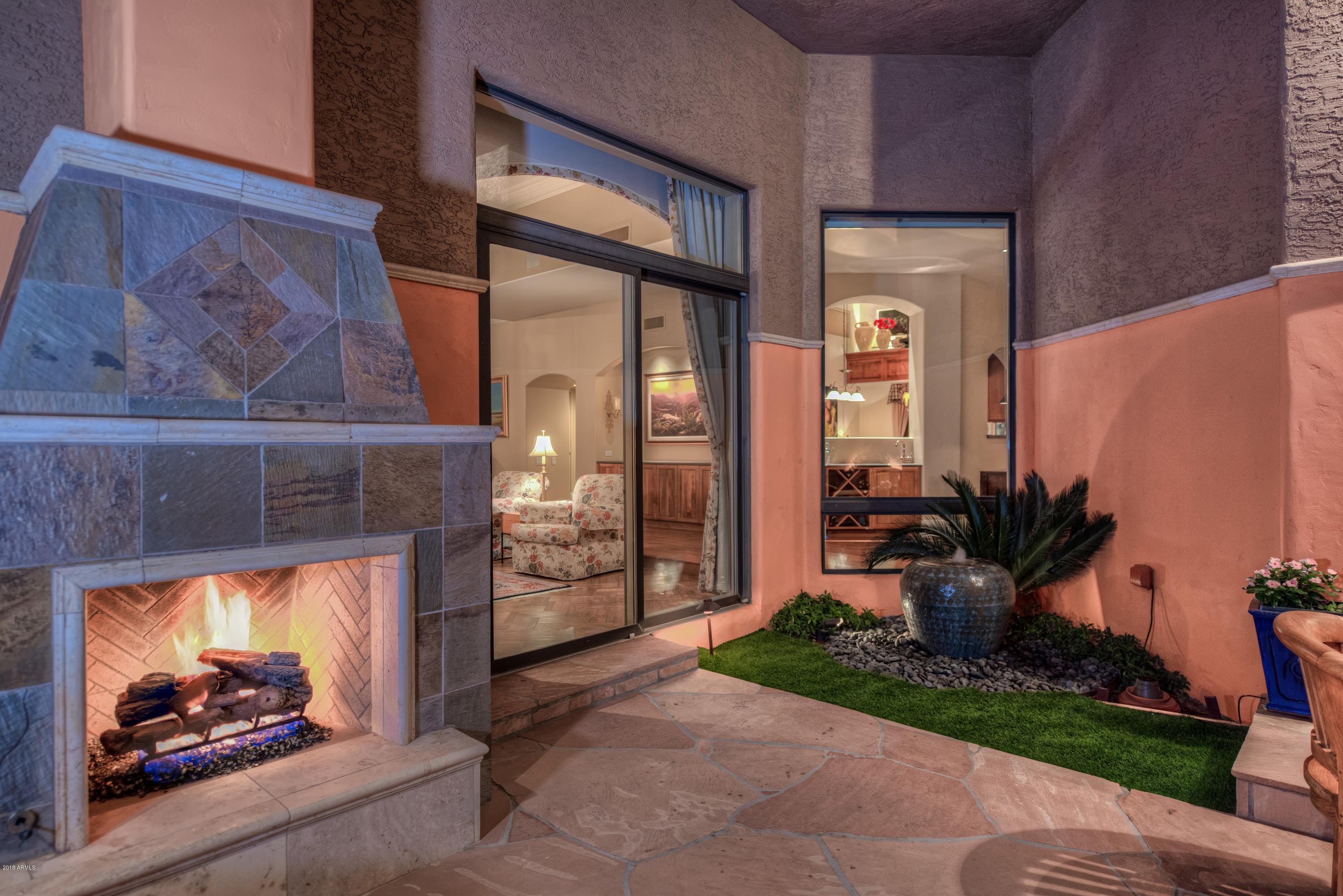 4450 East Camelback Road, Unit 9 Phoenix, AZ 85018 - Photo 40 of 41 043_Outdoor Fireplace and Fountain