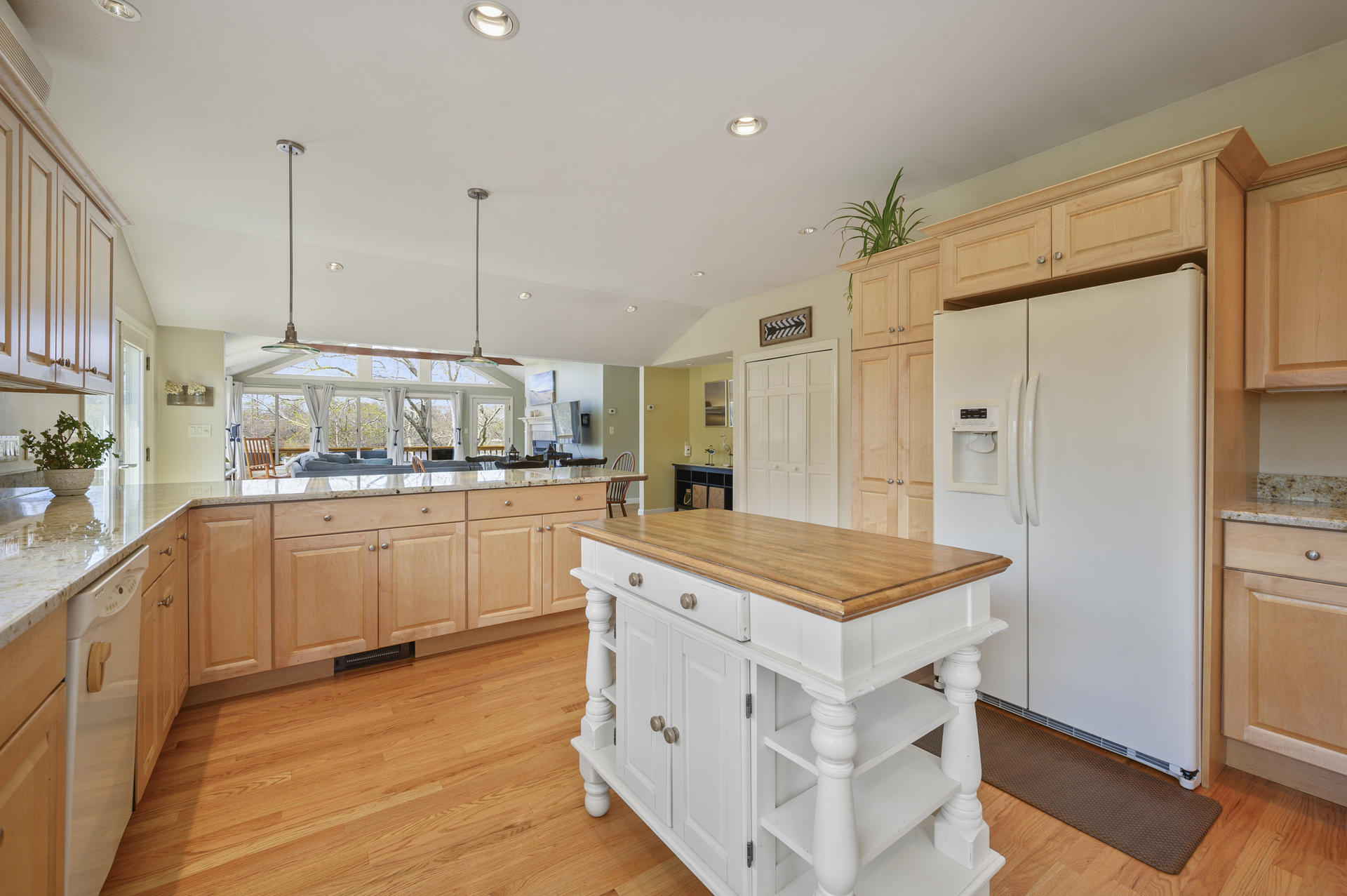 48 Locust Road Orleans, MA 02653 - Photo 12 of 36 a kitchen with white cabinets and stainless steel appliances