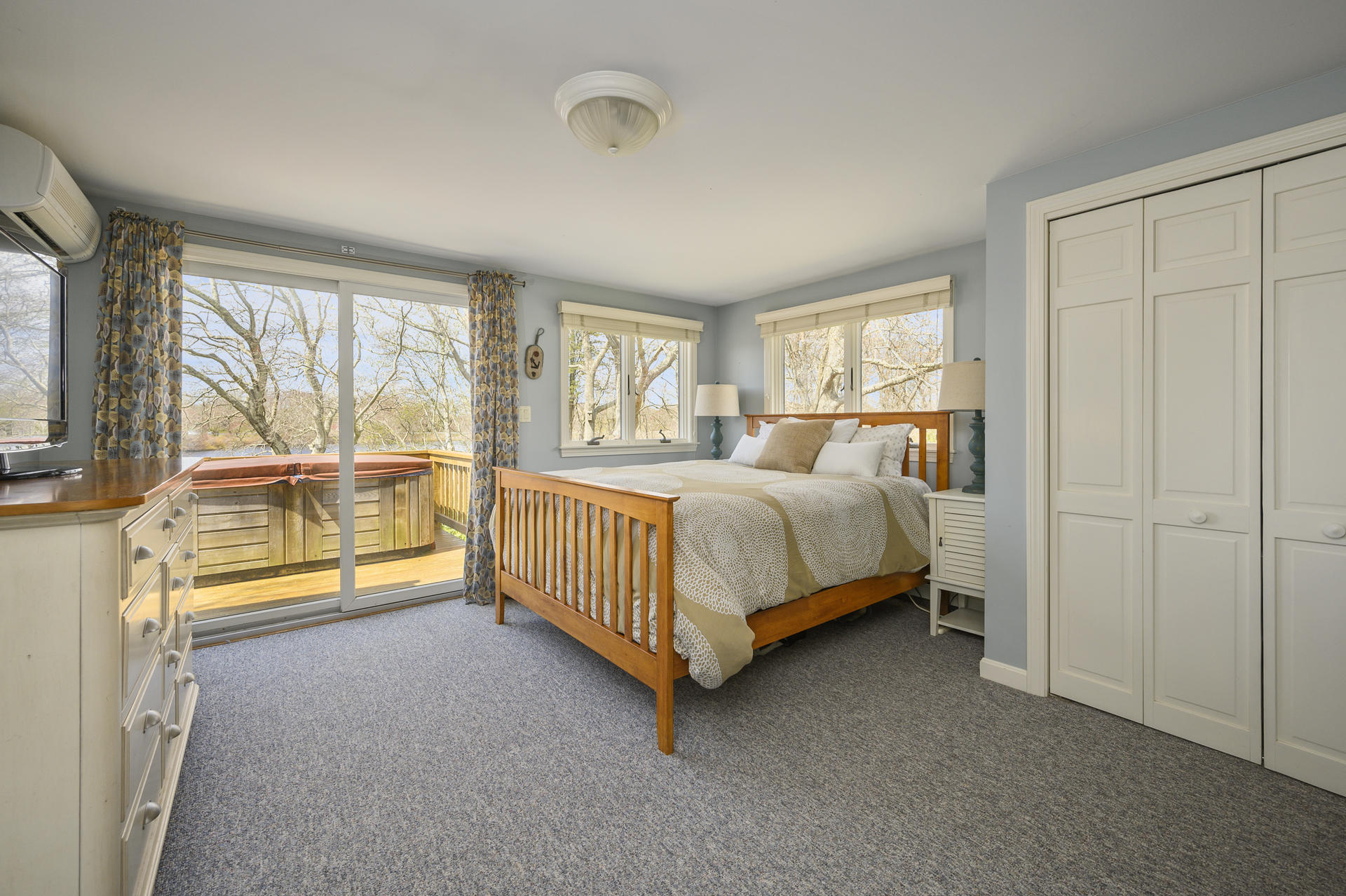 48 Locust Road Orleans, MA 02653 - Photo 13 of 36 a bed sitting in a spacious bedroom next to a window