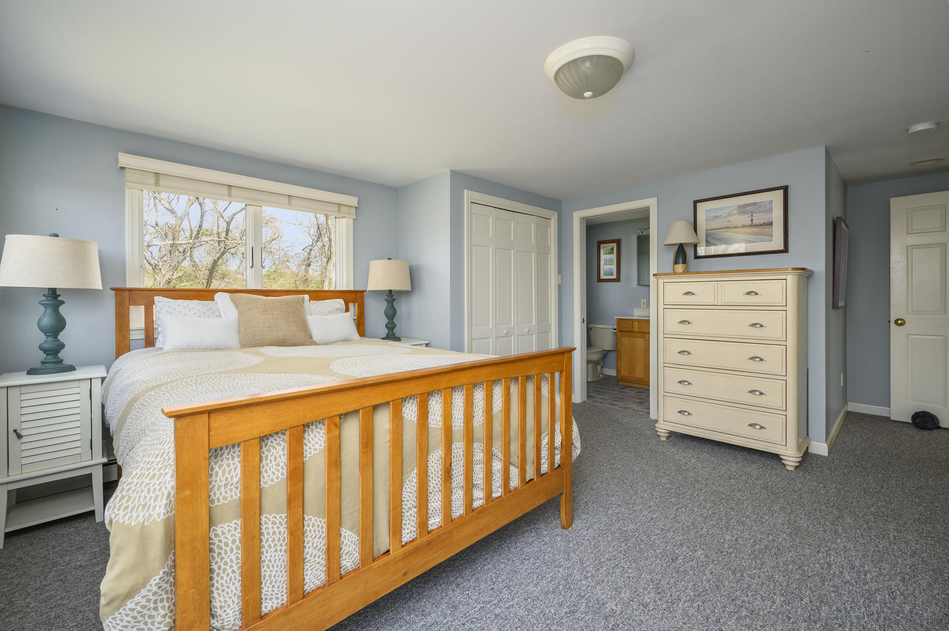 48 Locust Road Orleans, MA 02653 - Photo 14 of 36 a bedroom with a bed and a window