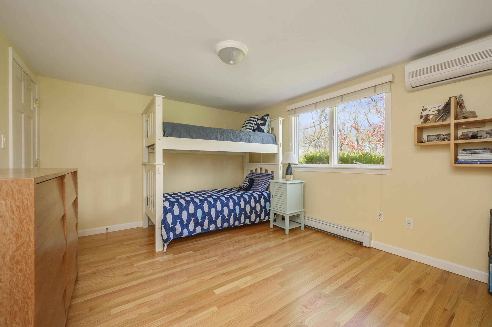 48 Locust Road Orleans, MA 02653 - Photo 16 of 36 a bedroom with a bed and wooden floor