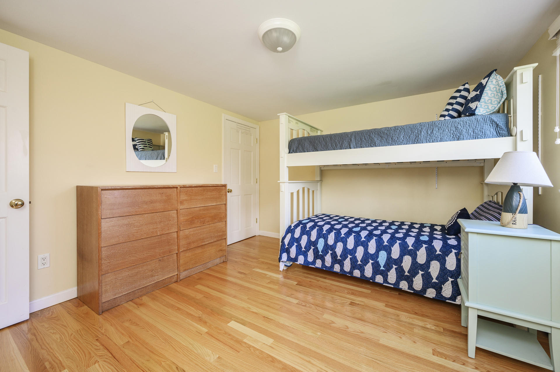 48 Locust Road Orleans, MA 02653 - Photo 17 of 36 a bedroom with a bed and a dresser