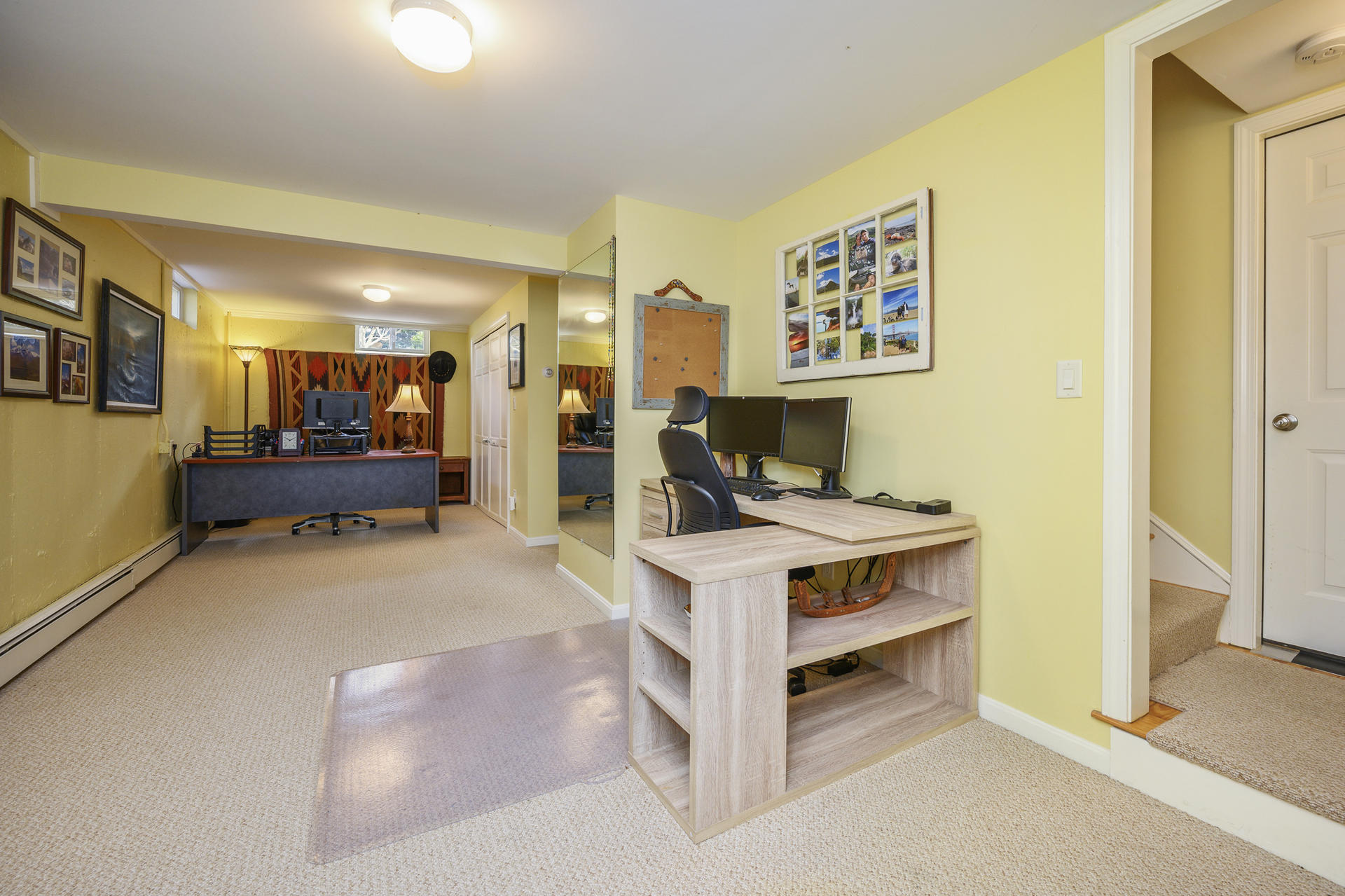 48 Locust Road Orleans, MA 02653 - Photo 20 of 36 a view of a workspace with furniture and a flat screen tv