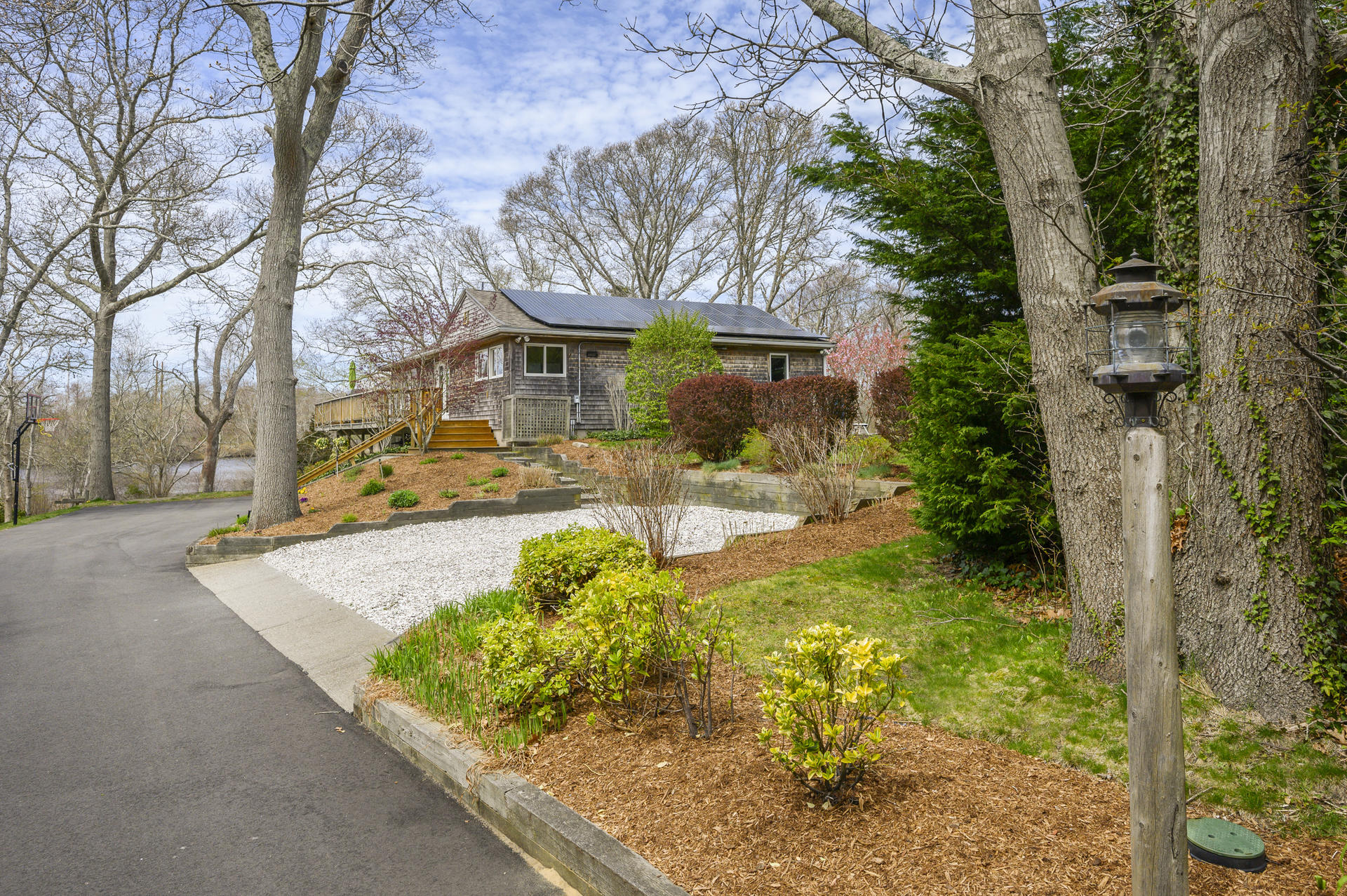 48 Locust Road Orleans, MA 02653 - Photo 2 of 36 a front view of a house with garden