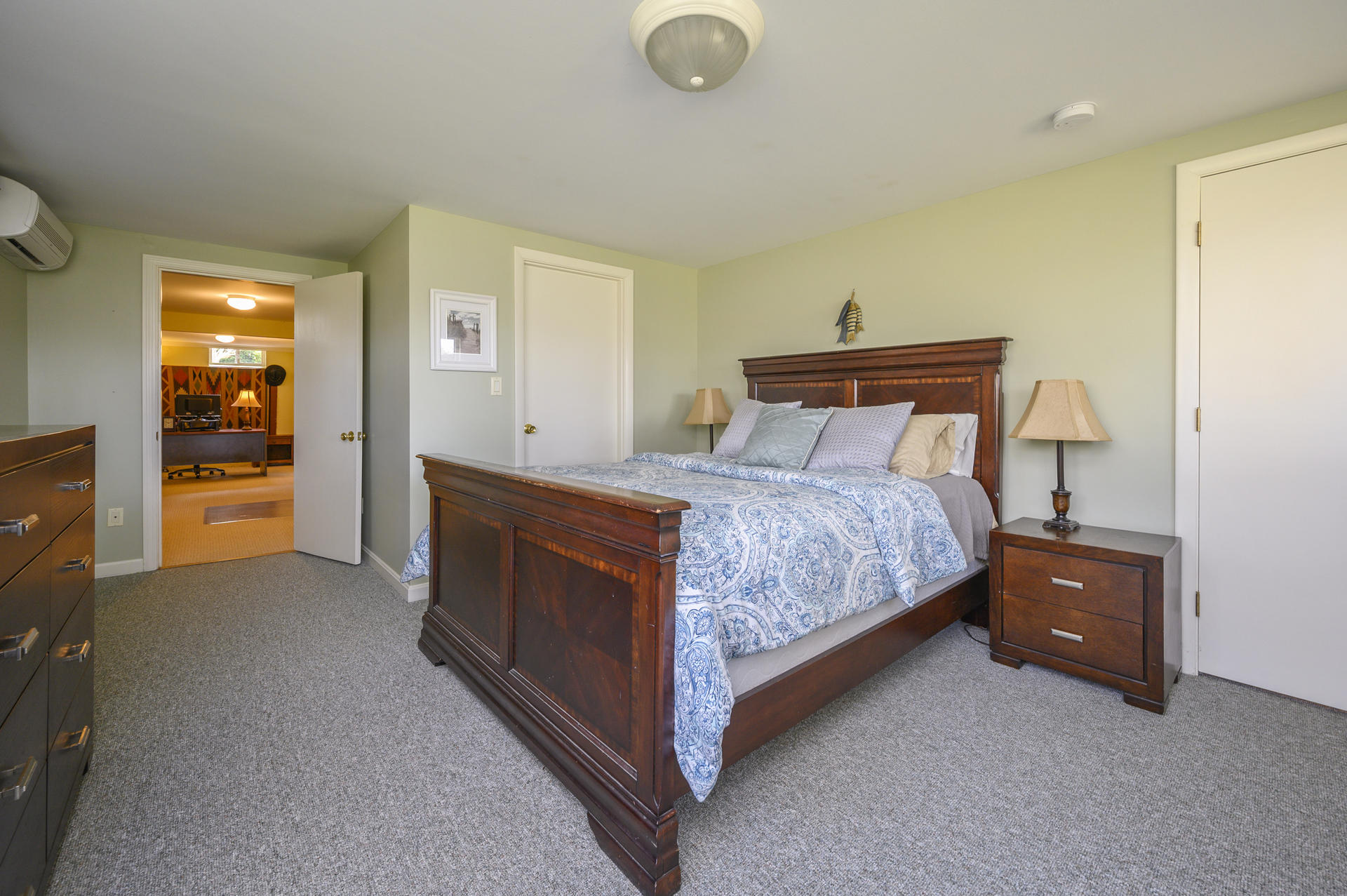 48 Locust Road Orleans, MA 02653 - Photo 23 of 36 a bedroom with a bed and a lamp on table