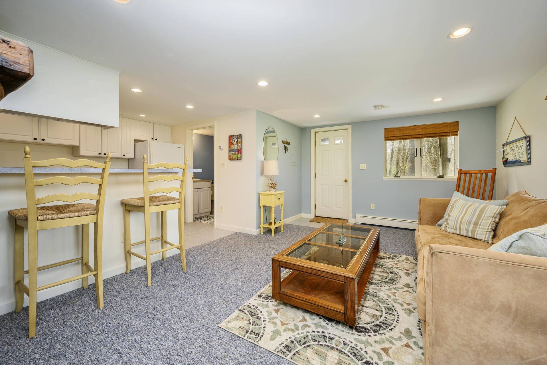 48 Locust Road Orleans, MA 02653 - Photo 25 of 36 a living room with furniture and a table