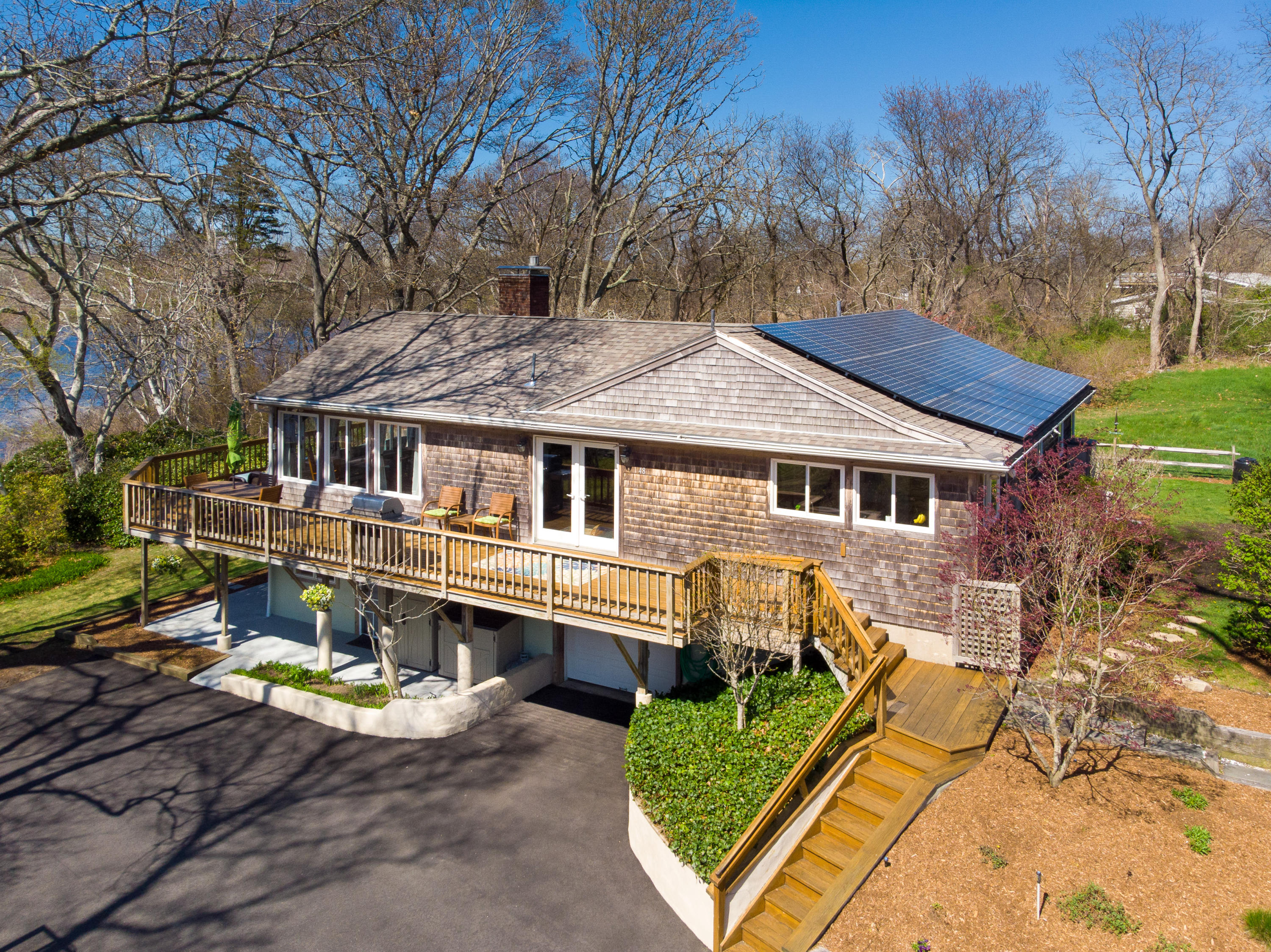 48 Locust Road Orleans, MA 02653 - Photo 3 of 36 a front view of a house with garden