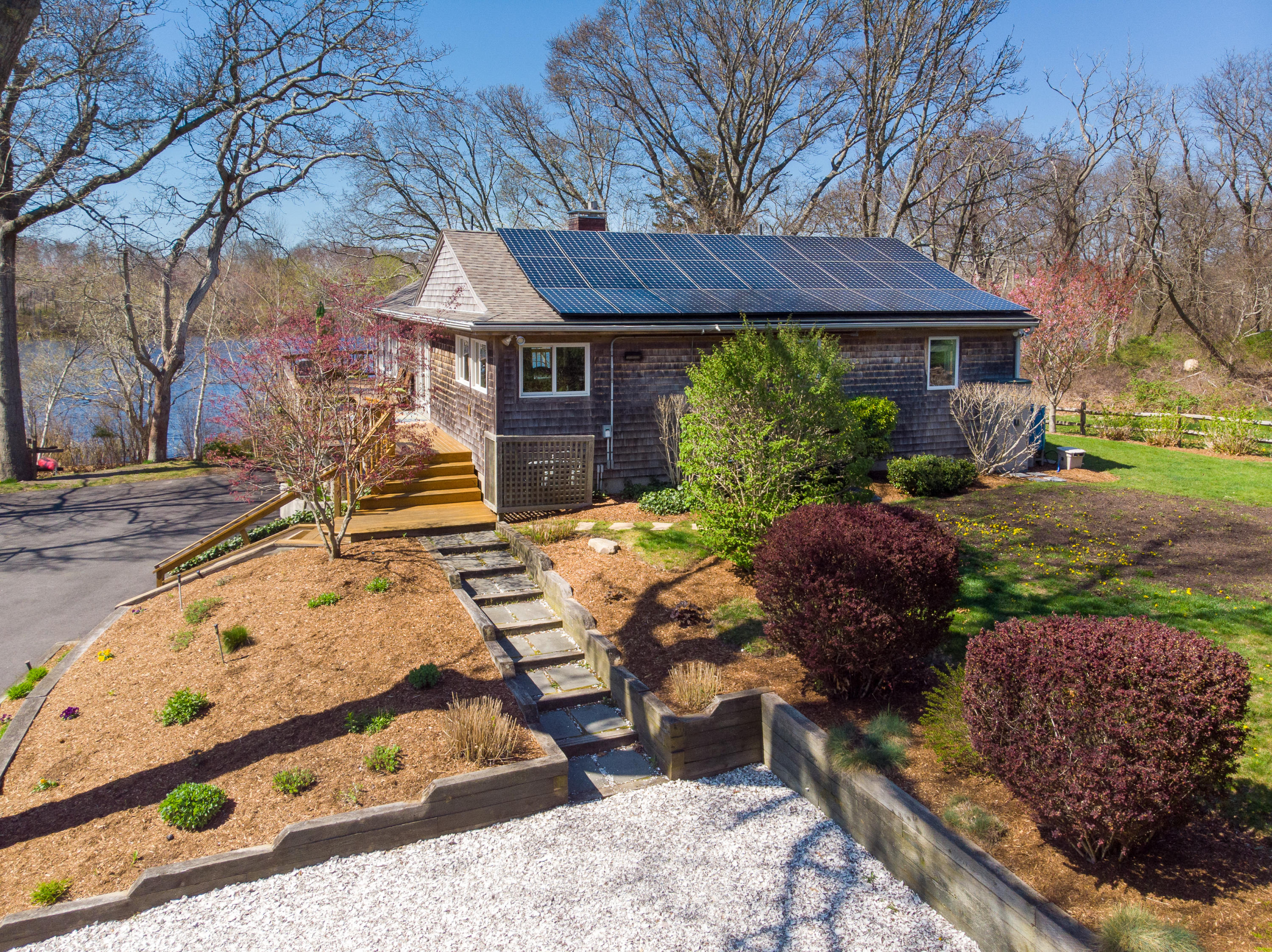 48 Locust Road Orleans, MA 02653 - Photo 31 of 36 a view of backyard with seating space and covered with trees