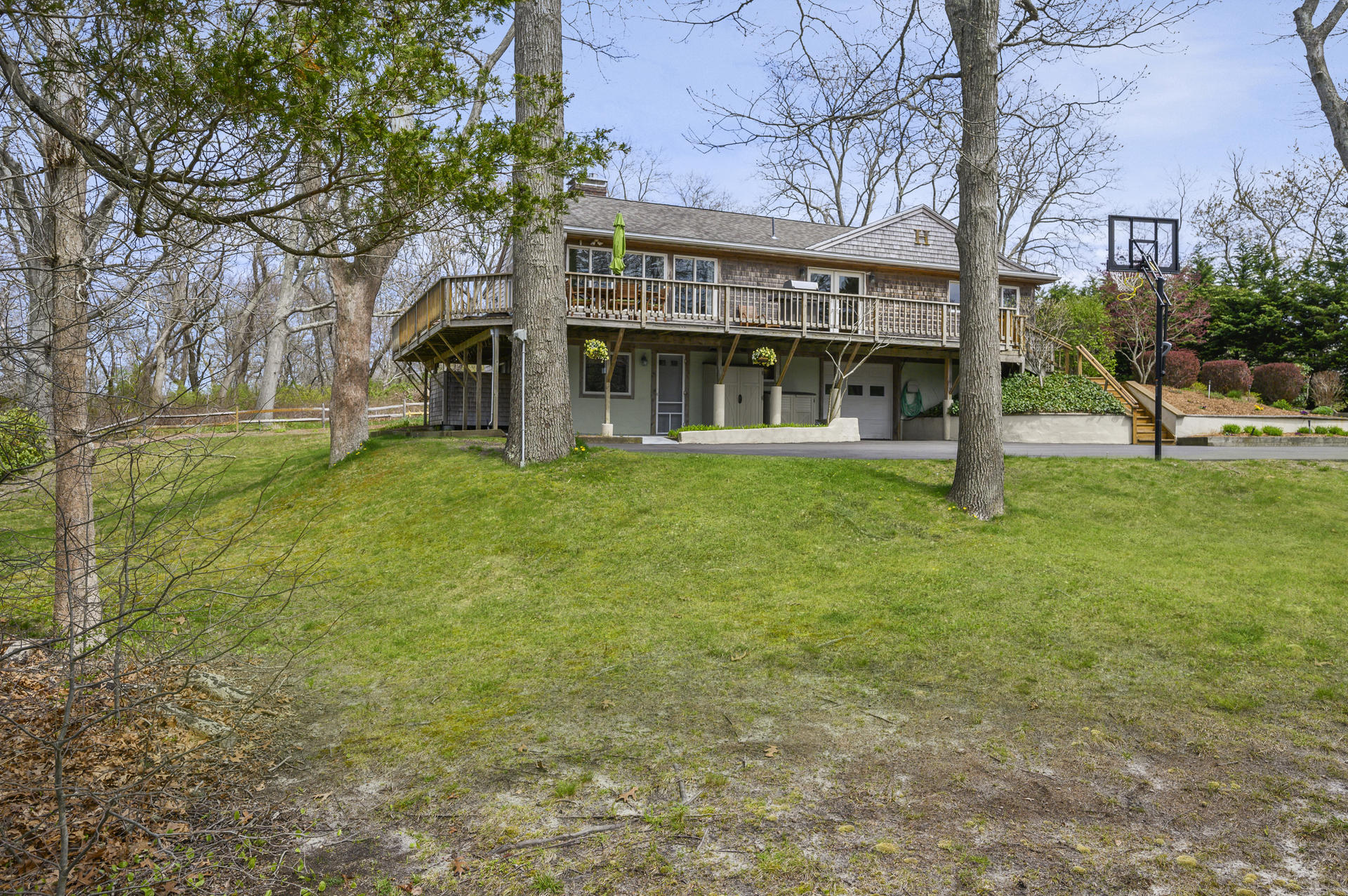48 Locust Road Orleans, MA 02653 - Photo 32 of 36 front view of a building with a yard