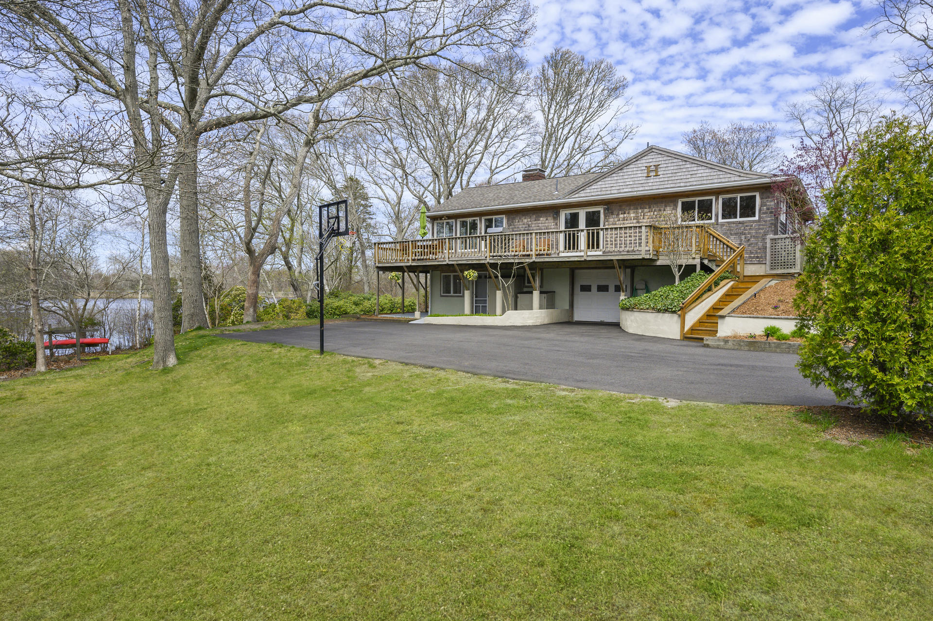 48 Locust Road Orleans, MA 02653 - Photo 33 of 36 a view of house with outdoor space and porch