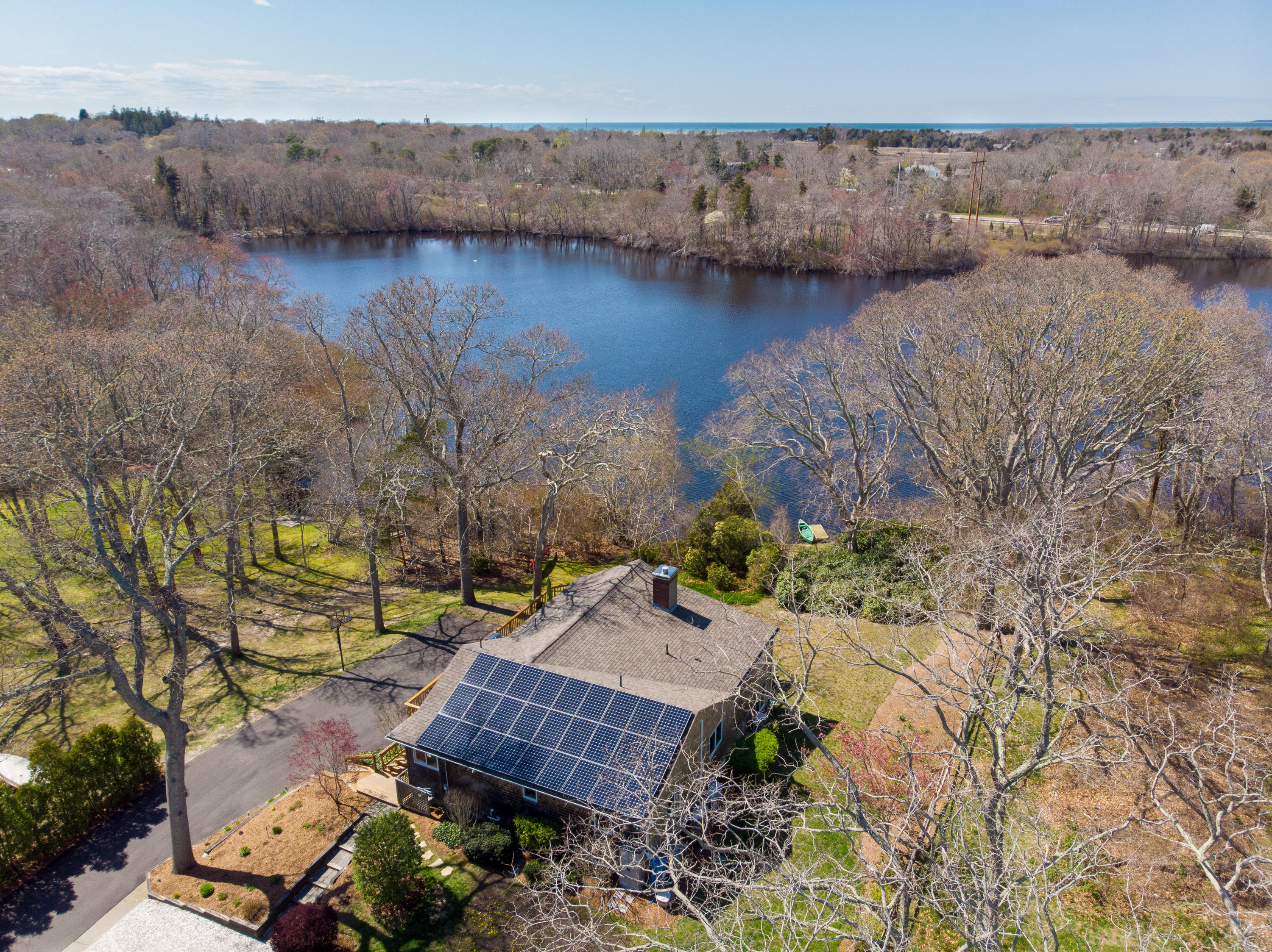 48 Locust Road Orleans, MA 02653 - Photo 35 of 36 an aerial view of a house with a lake view