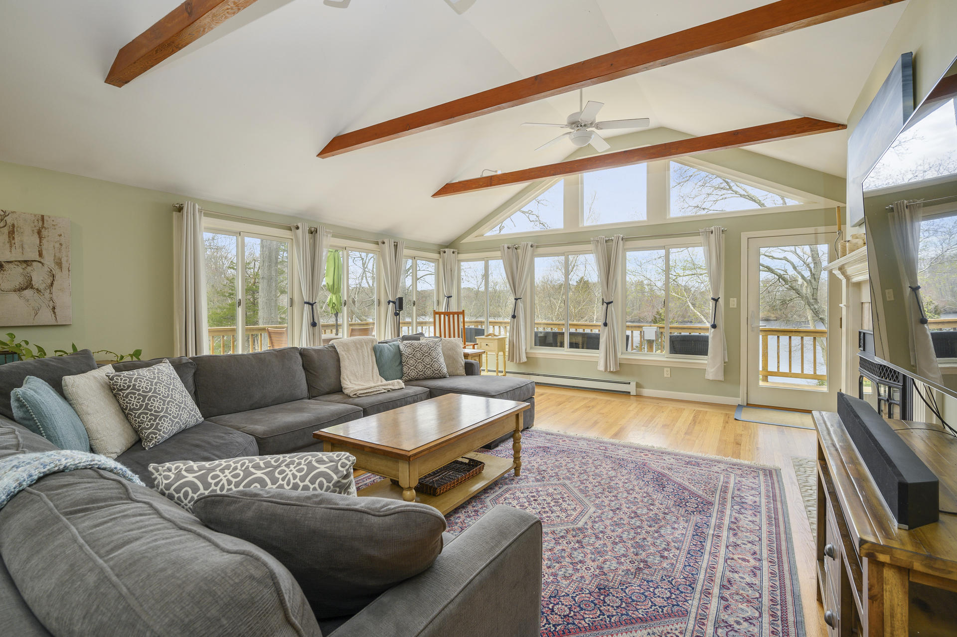 48 Locust Road Orleans, MA 02653 - Photo 6 of 36 a living room with furniture and a large window
