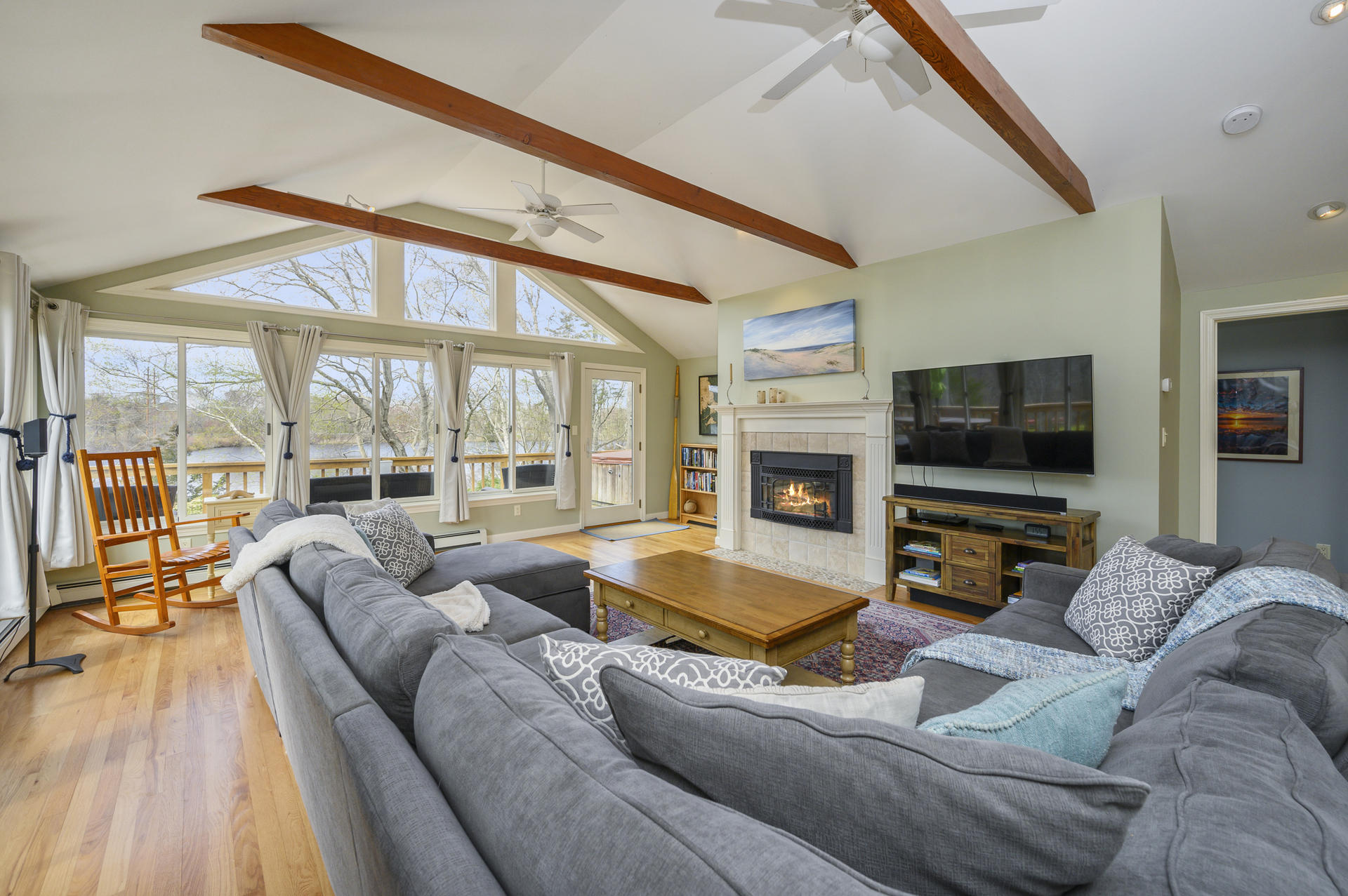48 Locust Road Orleans, MA 02653 - Photo 7 of 36 a living room with furniture and a flat screen tv