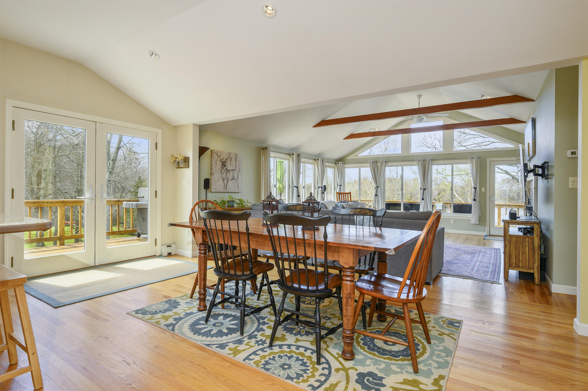 48 Locust Road Orleans, MA 02653 - Photo 9 of 36 a view of a dining room with furniture window and wooden floor