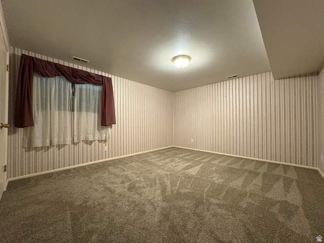 595 Meadowlark Road Orem, UT 84097 - Photo 56 of 87 Carpeted interior room with striped wall covering