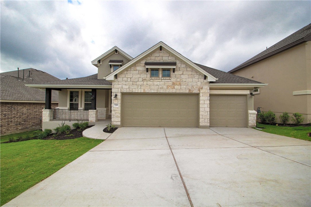 728 Jacksdaw Drive Austin, TX 78737 - Photo 1 of 1 a front view of a house with garden