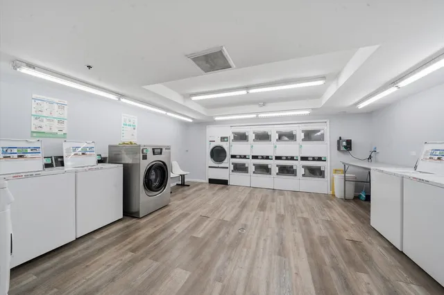 a view of a kitchen with sink and cabinets