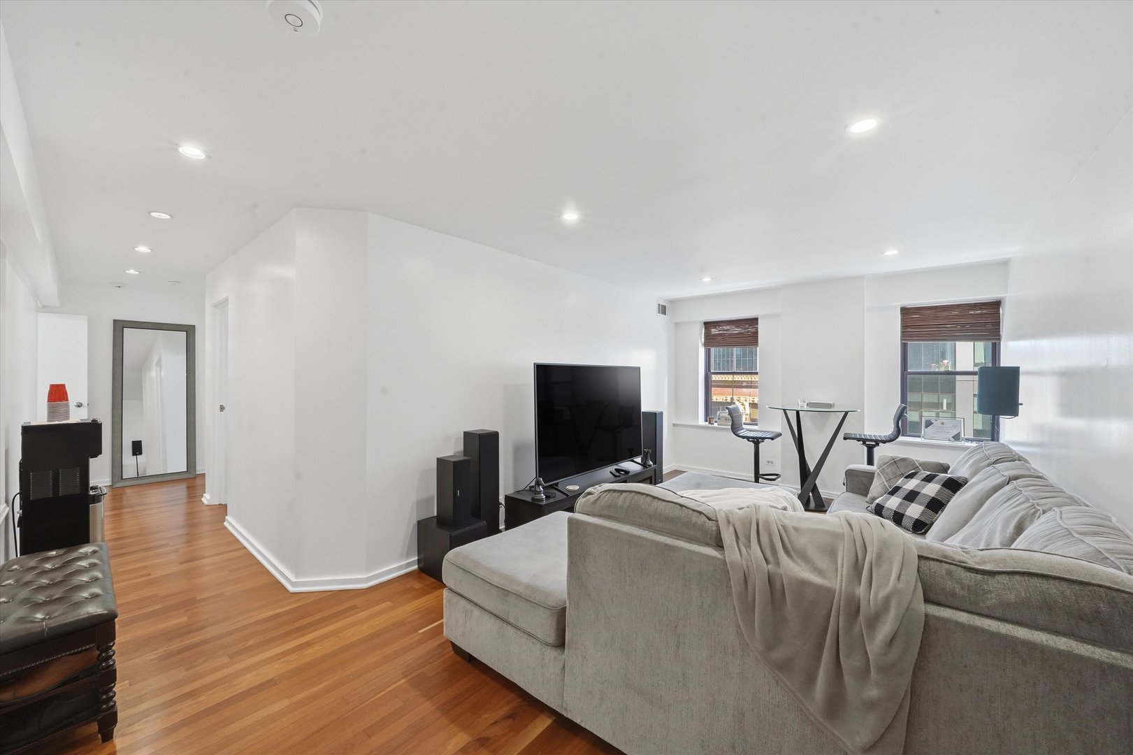 40 East 9th Street, Unit 1005 Chicago, IL 60605 - Photo 7 of 30 a living room with furniture and a flat screen tv