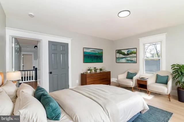 a bedroom with a bed and a couch