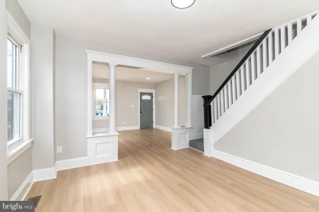 a view of an entryway with wooden floor