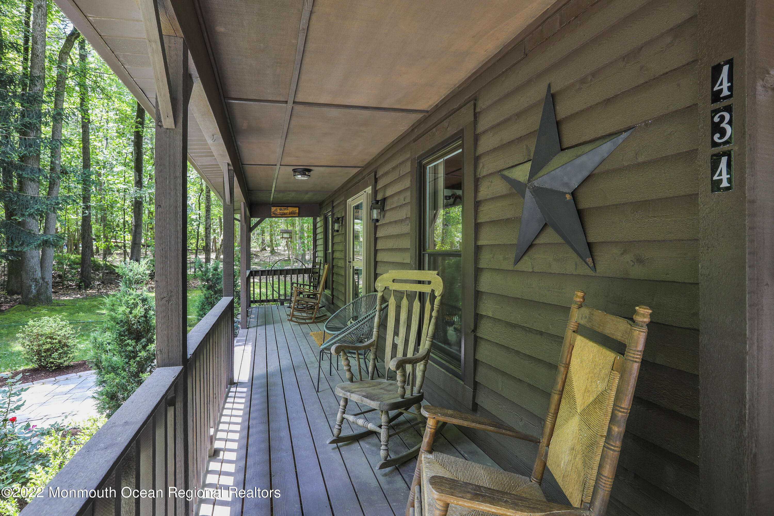 434 Freehold Road Jackson, NJ 08527 - Photo 8 of 45 a view of balcony with wooden floor and outdoor seating