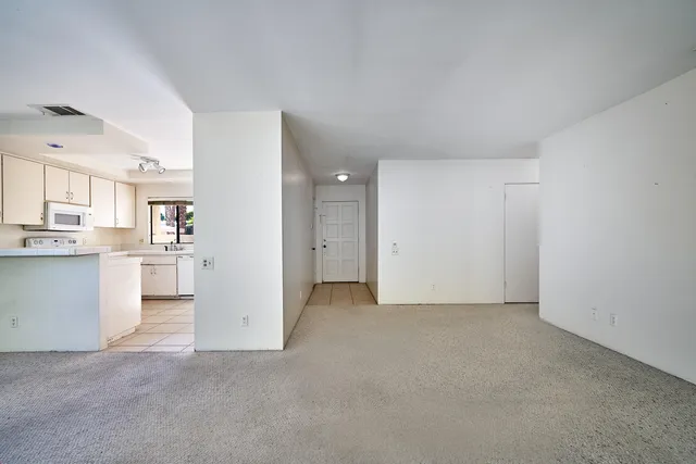 a view of a kitchen with a sink