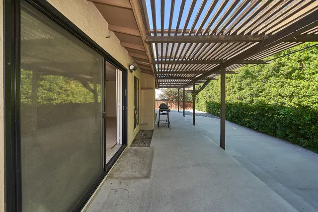 a view of a porch with wooden floor and stairs