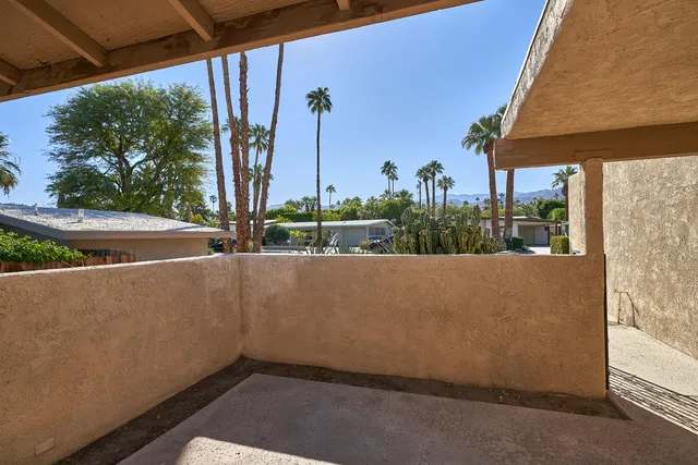 a view of balcony with furniture