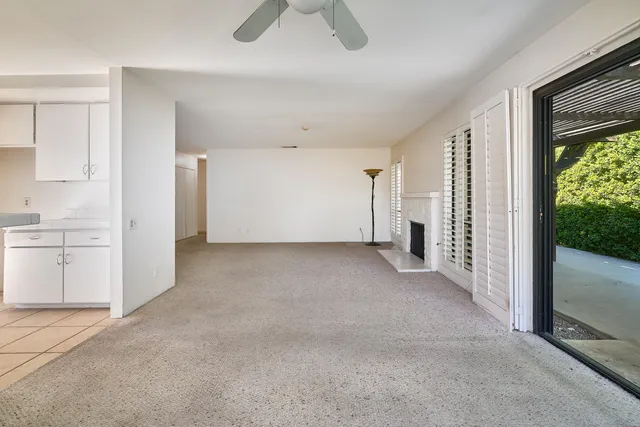 a view of empty room with floor to ceiling window