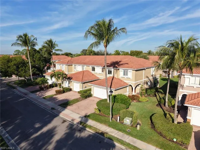 a view of a chairs and table in patio