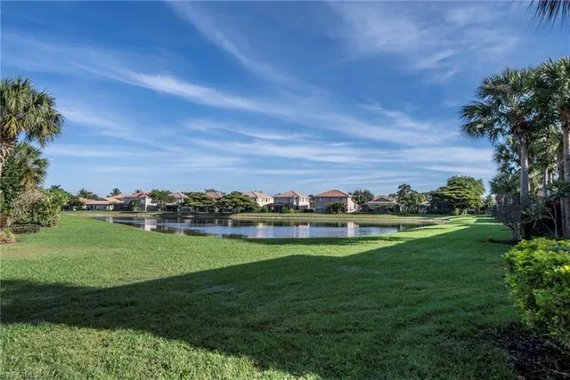 a view of a golf course with a lake