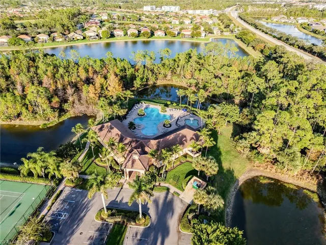 an aerial view of a residential houses with outdoor space