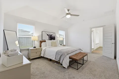 a bedroom with a bed and window