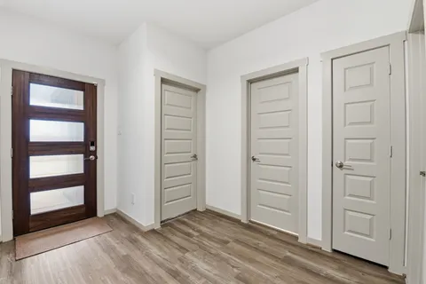 a kitchen with a sink stainless steel appliances and cabinets