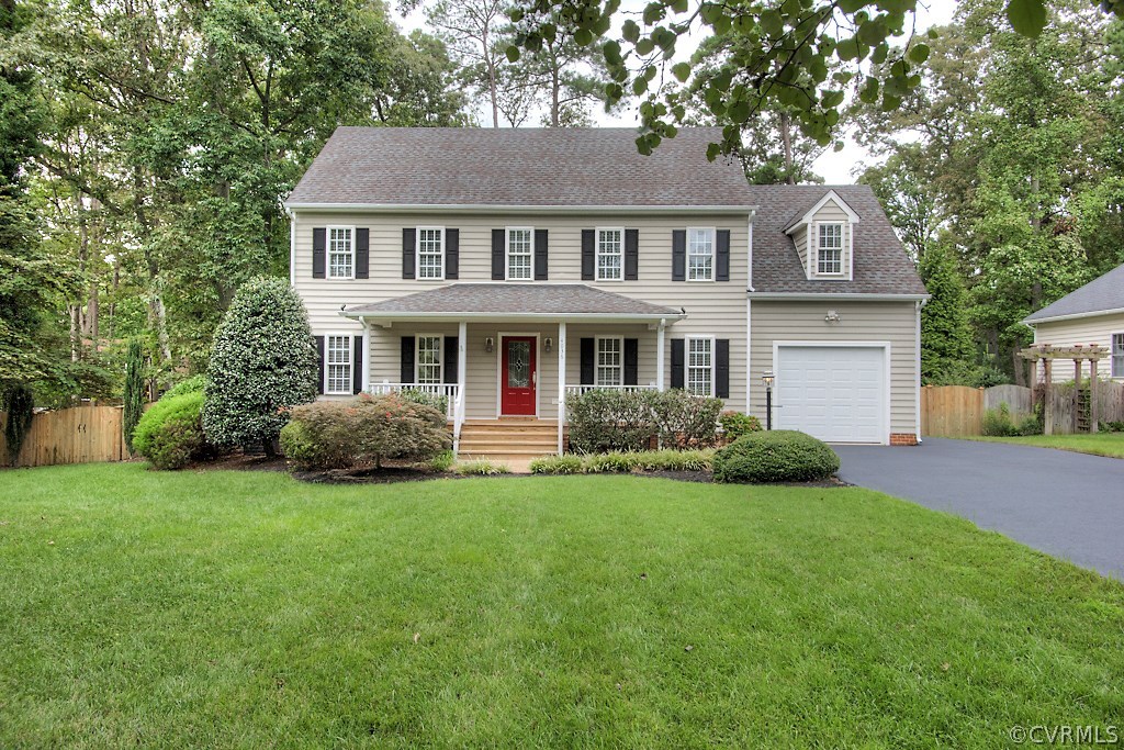 4036 Collingbourne Road Richmond, VA 23235 - Photo 1 of 43 a front view of a house with a garden