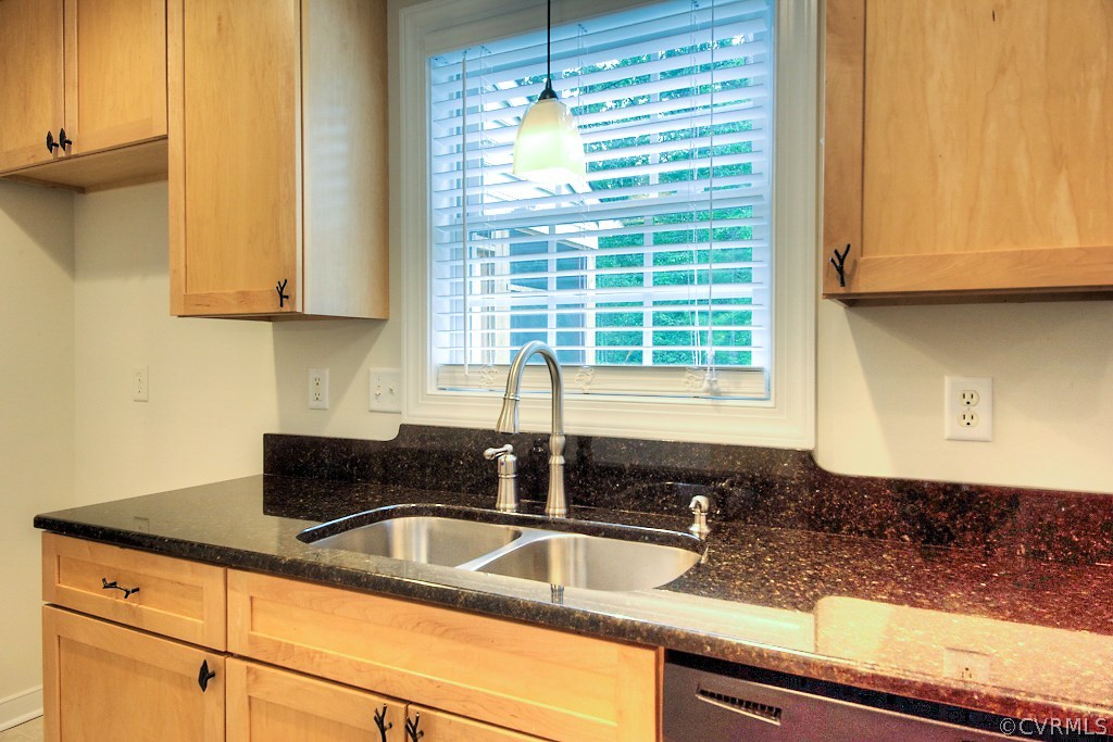 4036 Collingbourne Road Richmond, VA 23235 - Photo 14 of 43 a kitchen with granite countertop a sink a window and cabinets