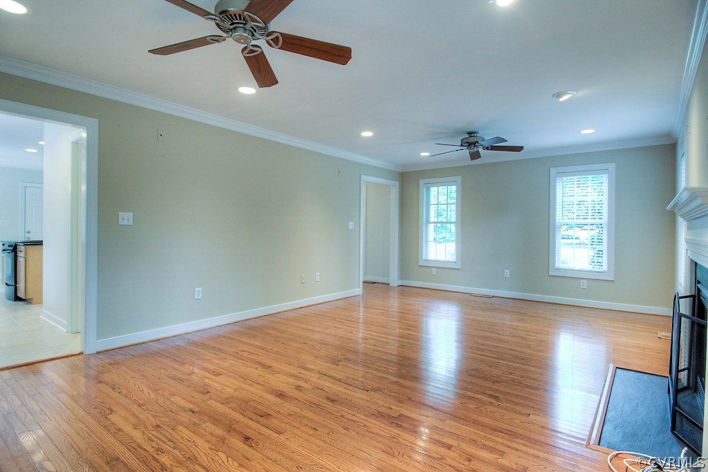 4036 Collingbourne Road Richmond, VA 23235 - Photo 19 of 43 a view of an empty room with wooden floor and a window