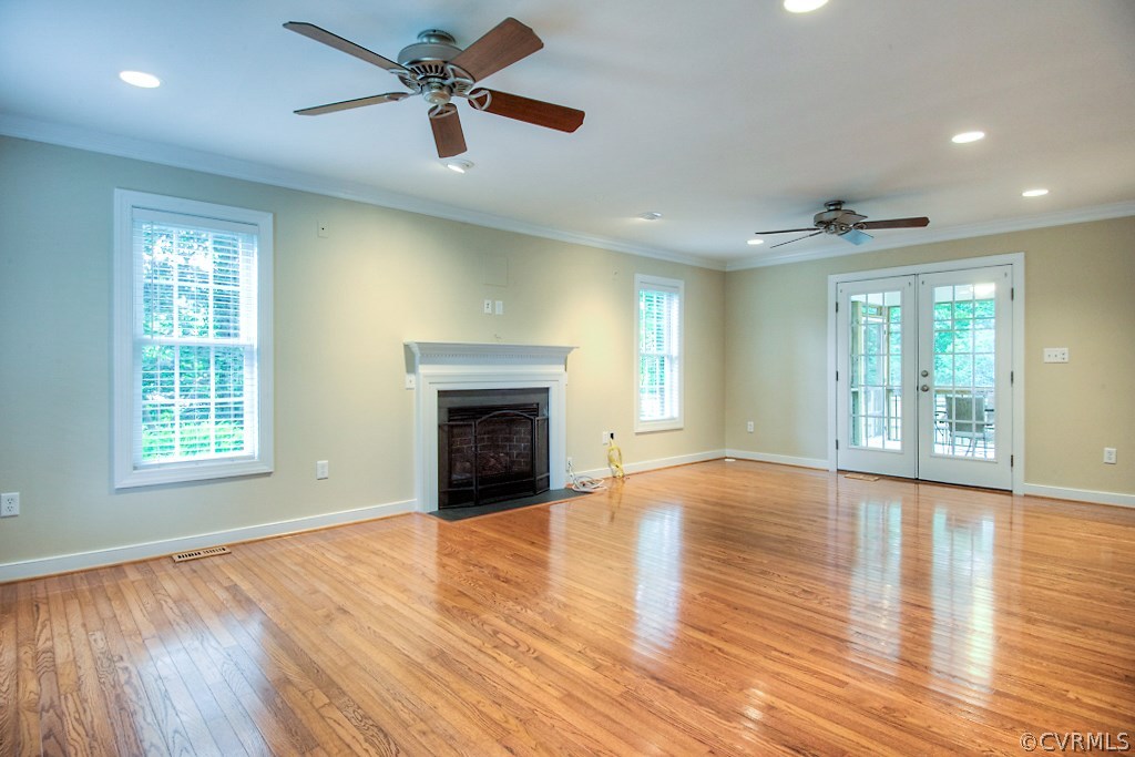 4036 Collingbourne Road Richmond, VA 23235 - Photo 20 of 43 a view of an empty room with window and wooden floor