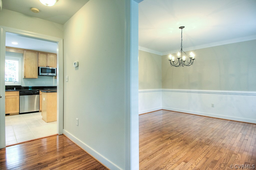 4036 Collingbourne Road Richmond, VA 23235 - Photo 21 of 43 a view of a room with a chandelier