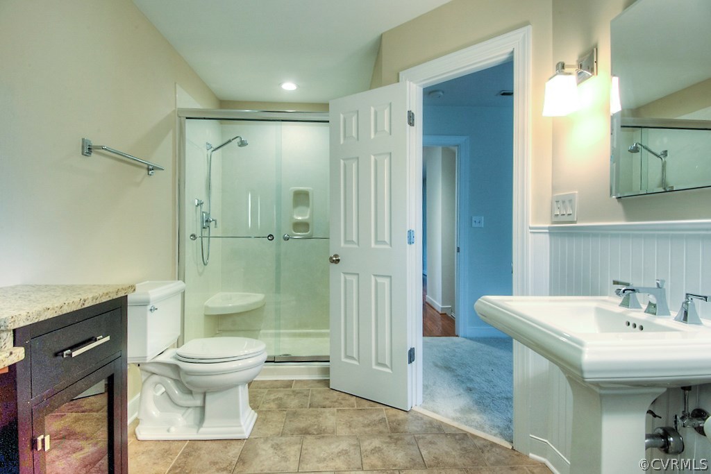 4036 Collingbourne Road Richmond, VA 23235 - Photo 26 of 43 a bathroom with a sink toilet and shower