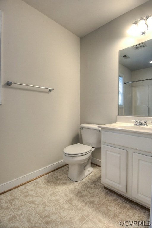 4036 Collingbourne Road Richmond, VA 23235 - Photo 27 of 43 a bathroom with a toilet a sink a vanity and mirror