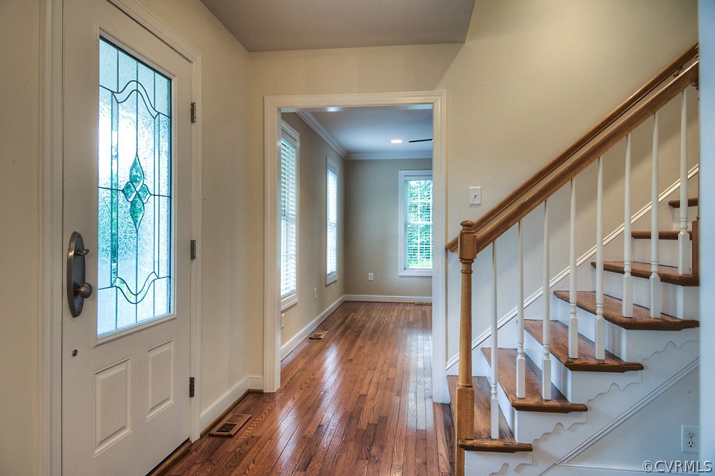 4036 Collingbourne Road Richmond, VA 23235 - Photo 5 of 43 a view of entryway with wooden floor and stairs