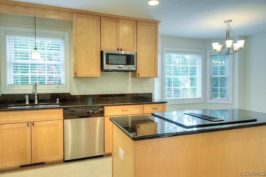 4036 Collingbourne Road Richmond, VA 23235 - Photo 9 of 43 a kitchen with granite countertop a sink a stove and cabinets