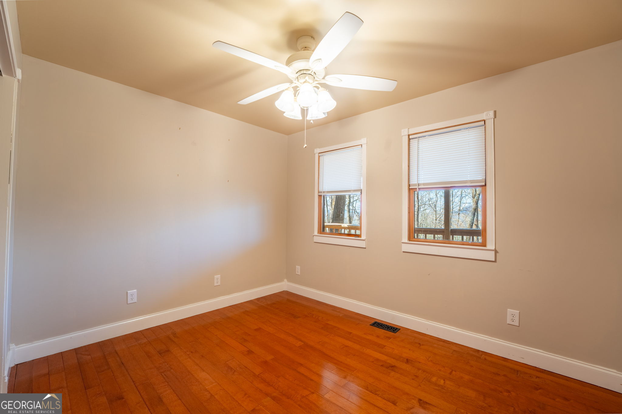 44 Juniper Trail Clayton, GA 30525 - Photo 16 of 87 wooden floor in an empty room with a window