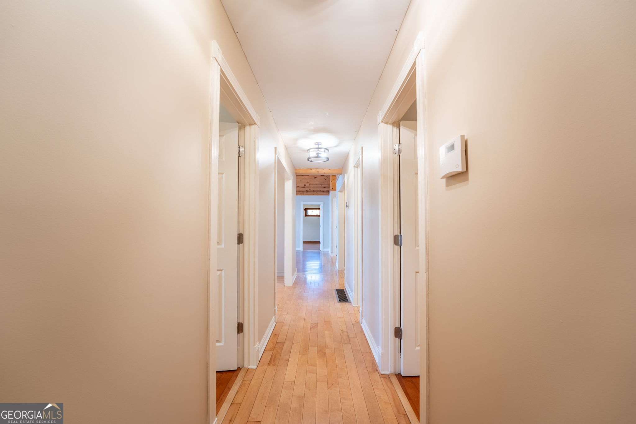 44 Juniper Trail Clayton, GA 30525 - Photo 20 of 87 a view of a hallway with wooden floor and staircase