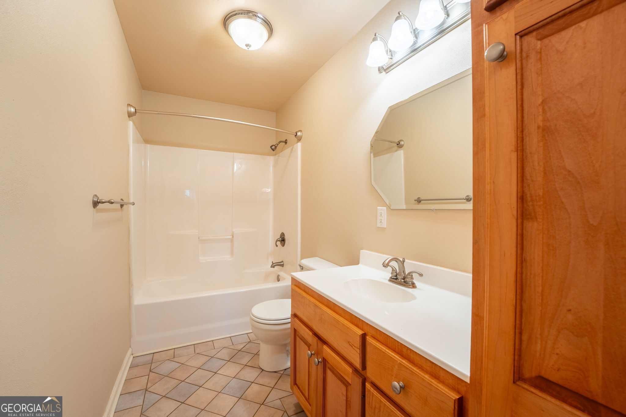 44 Juniper Trail Clayton, GA 30525 - Photo 26 of 87 a bathroom with a double vanity sink toilet mirror and shower